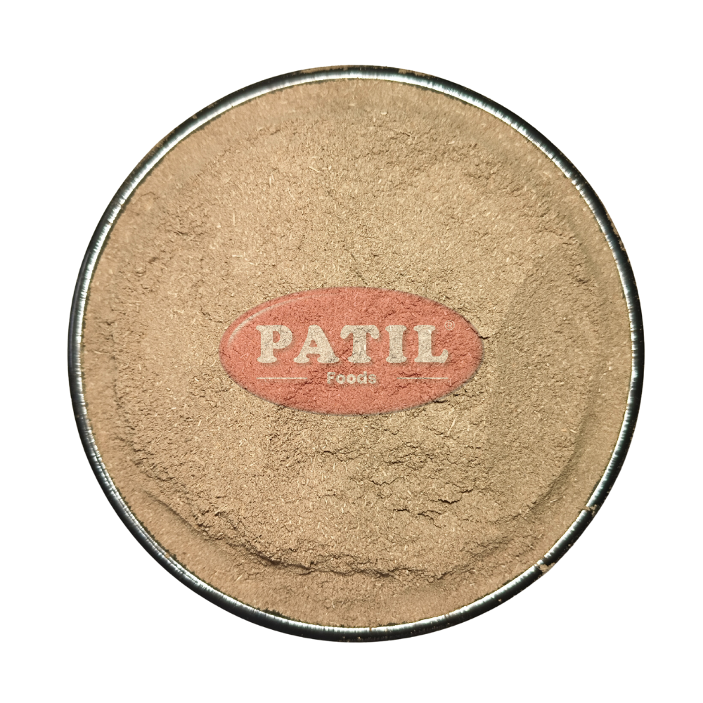Closeup of Amar Bel powder showing fine texture and natural greenish brown color