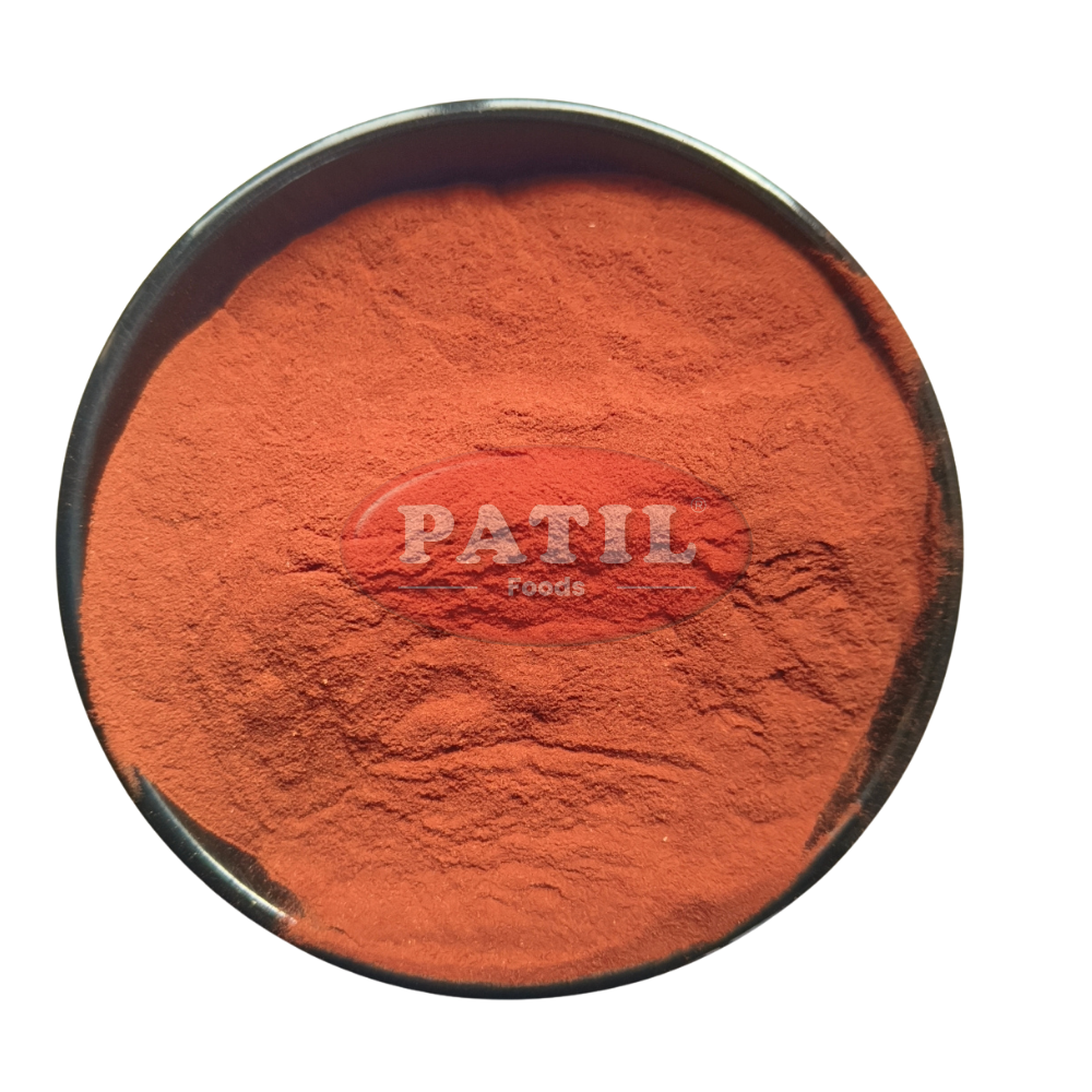 Closeup of Kamila powder showing fine texture and vibrant red natural color