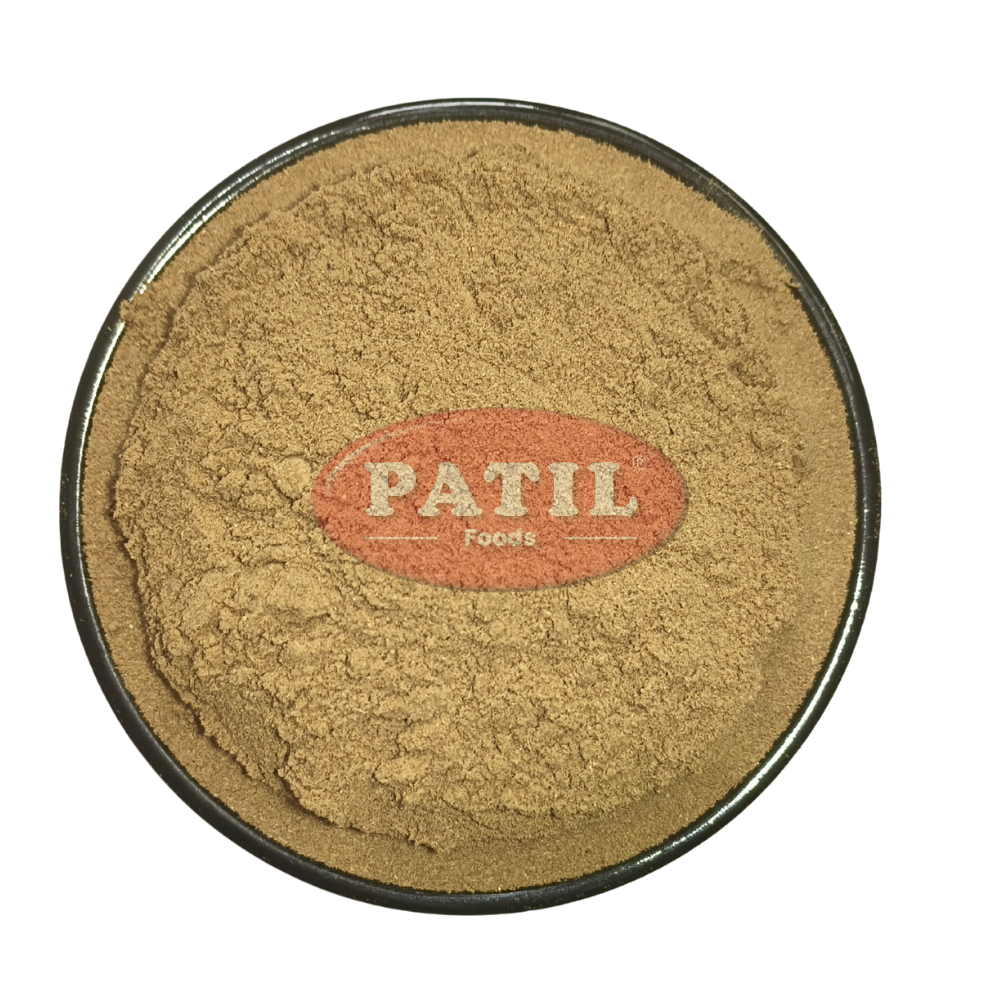 Closeup of Triphala powder showing fine texture and natural brown herbal blend