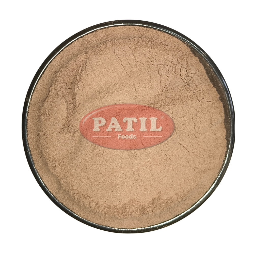 Closeup of Arjuna bark powder showing fine texture and natural brown color
