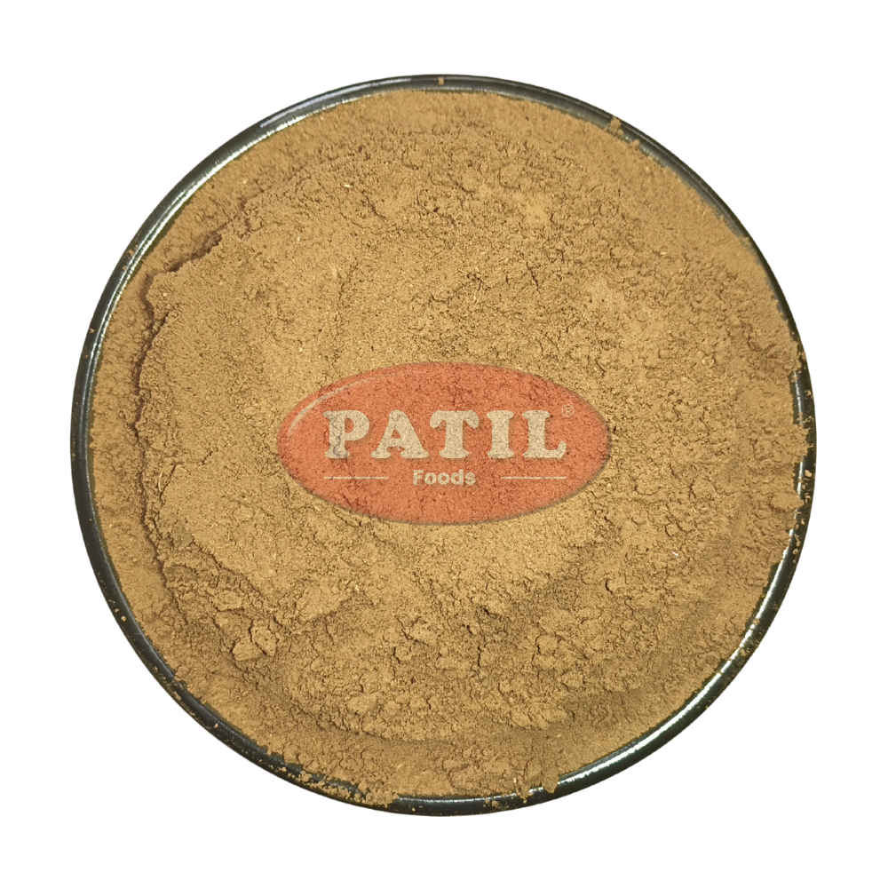 Closeup of Revand Chini powder showing fine texture and natural earthy color