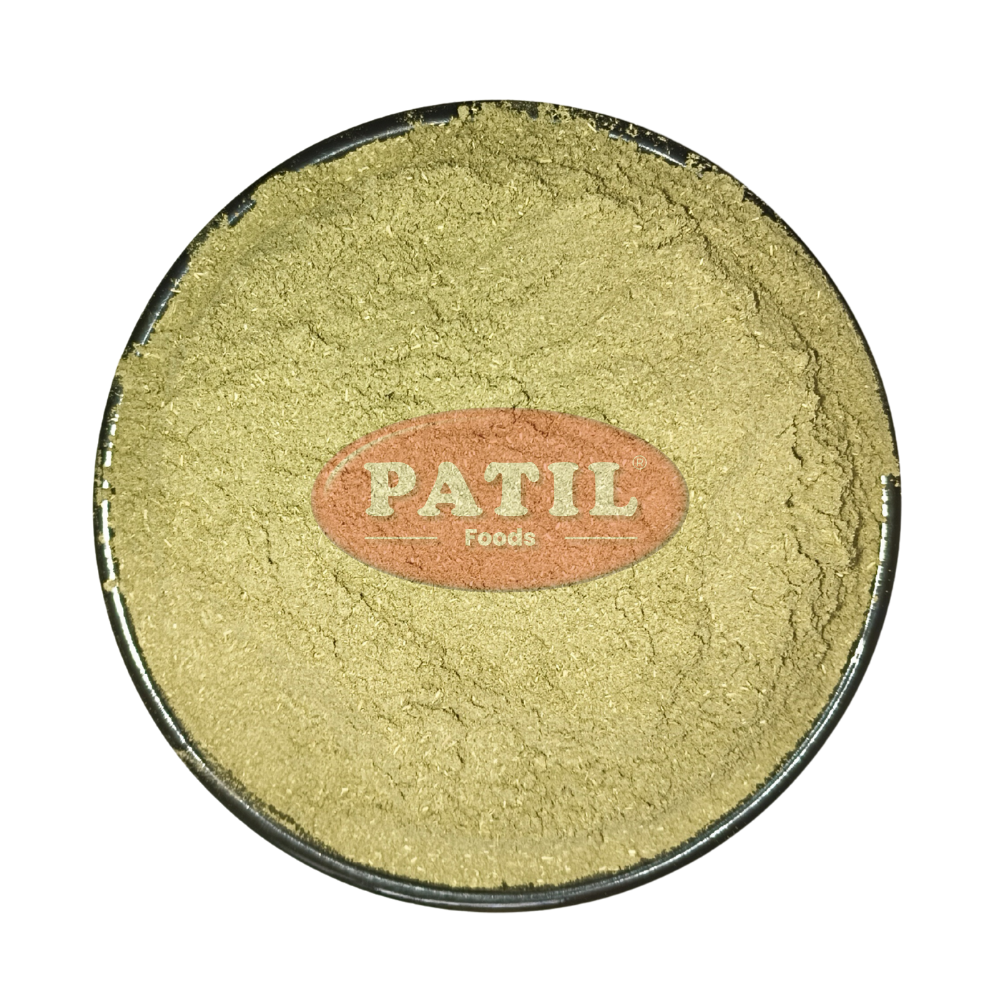 Closeup of Gudmar powder showing fine texture and natural greenish brown color