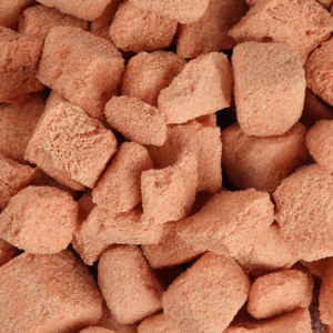 Close-up of freeze-dried guava chunks showing crispy texture, vibrant color, and purity by Patil Foods