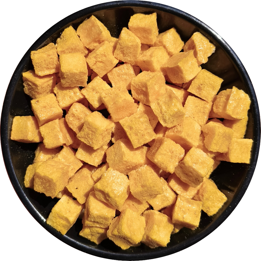 Close-up texture of freeze-dried mango cubes showing golden color, purity, and natural quality by Patil Foods